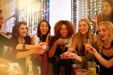 Photo for Party, nightclub and women with alcohol shots for birthday celebration, ladies night and social event. Cheers, toast and friends drinking to celebrate, happy hour and meet up for cocktail in pub. - Royalty Free Image