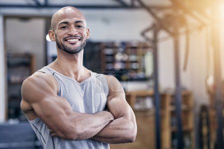 Photo for Arms crossed, fitness and portrait with bodybuilder man in gym for strength training or workout. Exercise, smile and wellness with happy athlete in health club for power or physical improvement. - Royalty Free Image