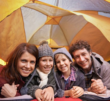 Photo for Portrait, smile and family camping in tent on vacation, holiday or travel together. Face, parents and happy children at campsite with kids bonding to relax with mother and father on adventure trip. - Royalty Free Image