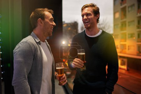 Photo for Smile, men and happy with beer at pub for nightlife, conversation and gathering on weekend. Communication, friends and alcohol with laughing for funny joke, comedy and discussion at restaurant. - Royalty Free Image