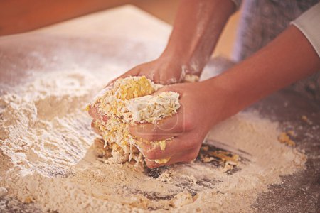 Photo for Person with flour, dough and pastry for baking in kitchen on table for dish, dessert and cookies. Food, cooking and hands with wheat ingredients for homemade pasta, cake or bread for culinary cuisine. - Royalty Free Image