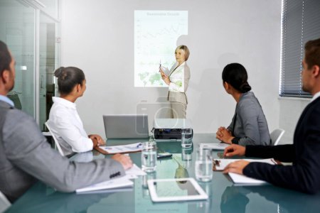 Photo for Presentation, business people and leader with projector screen, graphs for planning meeting and information in conference room. Data analysis, statistics and research for corporate project with team. - Royalty Free Image
