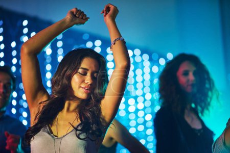 Photo for Dancing, woman and confidence in nightclub for birthday, new year and party or disco in Mexico. Smile, enjoyment and eyes closed in festival for concert, music and celebration on dance floor in city. - Royalty Free Image