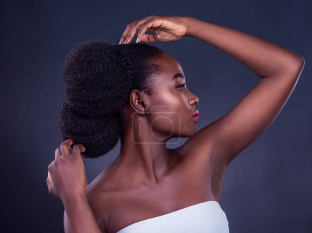 Photo for Black woman, shine or profile for beauty, skincare, natural makeup or healthy glow isolated in studio. Dermatology, hairstyle and African model with cosmetics, pride or results on dark background. - Royalty Free Image