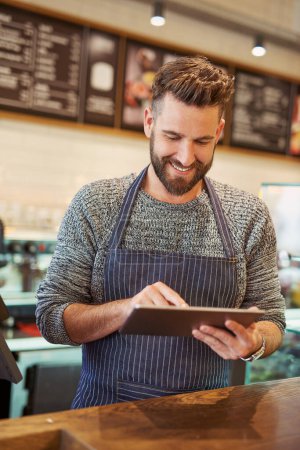 Photo for Happy, man and barista with tablet in cafe for restaurant sales, discounts and reviews on website online for management. Smile, owner and digital technology for e commerce, check list and menu update. - Royalty Free Image