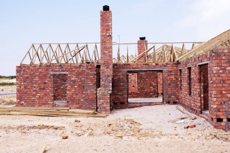 Photo for House, building and new real estate for construction, development and dream home project. Property, brick wall and architecture with structure frame, worksite and suburban improvement and design. - Royalty Free Image