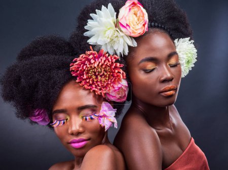 Photo for African, women and flowers in natural makeup on studio with gentle skincare with plants. Daisy, rose and peonies for wellness in beauty, cosmetics in spring and sustainable treatment for afro or hair. - Royalty Free Image