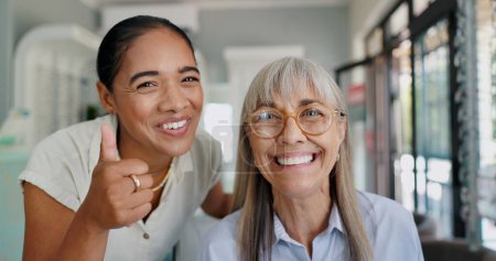 Photo for Women, doctor and patient with thumbs up on portrait for glasses, prescriptions and happy with choice. Optometrist, smile and confident at shop with support, trust and care for eyesight or eye care. - Royalty Free Image