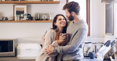 Photo for Couple, people and happy with hug in kitchen, together and support for unity. Relationship, happy and bonding for romance with commitment for care, help and trust as soulmate for love at home. - Royalty Free Image