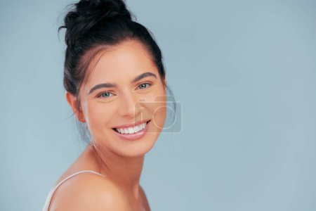 Photo for Woman, portrait and beauty with smile on blue background with face for happiness or cosmetic with pride. Confidence, skincare and glowing with hydration, radiance and fresh in the Netherlands - Royalty Free Image