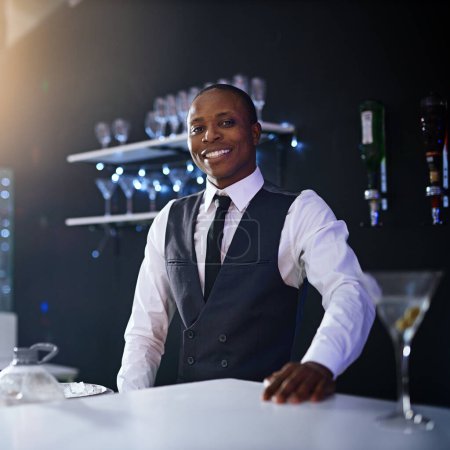 Photo for Black man, bartender and confident portrait in restaurant, hospitality and counter server for alcohol. Male person, cocktail and martini at winery or hotel bar, waiter pride and barman selection. - Royalty Free Image