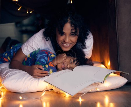 Photo for Reading, bedroom and portrait of kid with mom in home, smile and child together with mother for love. Young boy, pyjamas and storytelling with woman, night and relax on weekend and happy for book. - Royalty Free Image
