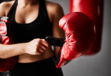 Photo for Gloves, ready or hands of woman in boxing training, exercise or workout in gym studio for wellness. Boxer, sports athlete or fist of girl with safety gear, fitness or equipment on grey background. - Royalty Free Image