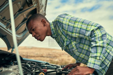 Photo for Black man, engine and check car issue on road, hood and roadside assistance for auto service. Male person, battery and power issue with vehicle on street, cables and driver for transport emergency. - Royalty Free Image