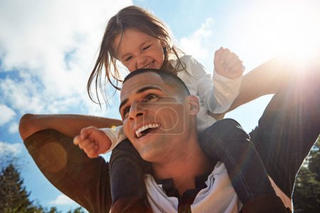 Photo for Sky, happy and dad with girl on shoulder in nature for outdoor adventure, child development and support. Love, smile and low angle of man with kid for funny bonding, care and playful on fathers day. - Royalty Free Image
