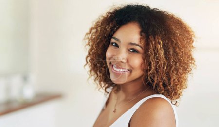 African woman, morning and bathroom in portrait with smile for makeup, routine for skin with glow. Female person, happiness and beauty in home for cosmetics or aesthetics, cheerful in Morocco.