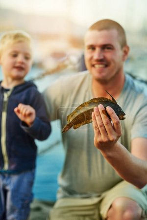 Photo for Father, child and portrait with fish or river together or son bonding or summer vacation, harbor or pride. Man, kid and happy in Florida for family hobby or learning with parent, development or skill. - Royalty Free Image
