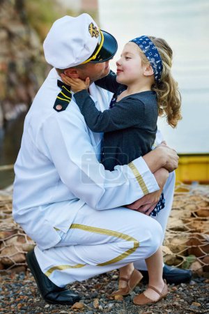 Photo for Father, navy and child hug with love for family reunion at sea dock or goodbye as captain sailor, daughter or service. Male person, girl and embrace in patriotic uniform as soldier, farewell or kiss. - Royalty Free Image