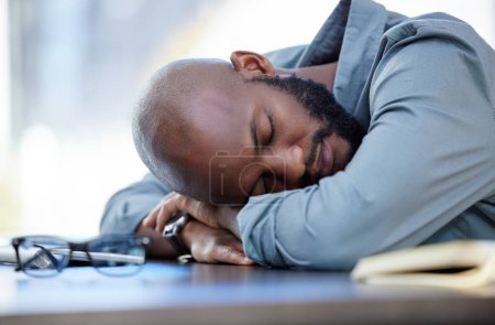 Photo for Man, sleeping and tired for work and desk, lazy employee and burnout for company project with fatigue. Overwhelmed, stress and exhausted worker in career, nap and low energy with African person. - Royalty Free Image