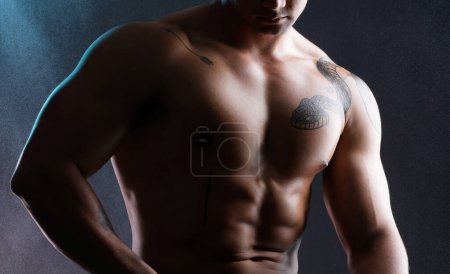 Photo for Man, body and fitness abs in studio for wellness or bodybuilder, strong and dark for power or strength. Person, six pack and stomach with muscle, isolated and black background for aesthetic shadow - Royalty Free Image