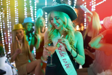 Photo for Woman, party and bride alcohol in club, bachelorette event and celebration at night rave. Female person, cocktail and drinking at happy hour for fun, confident and festival aesthetic for freedom. - Royalty Free Image
