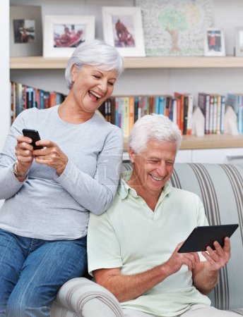 Photo for Senior couple, tablet and laugh for joke in home, comedy and streaming comic on social media. Elderly people, funny internet blog and relax on couch, bonding and happy in retirement for online love. - Royalty Free Image