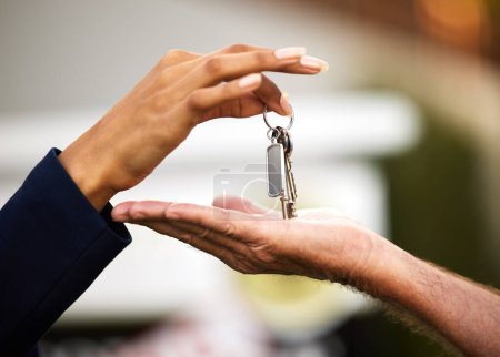 Photo for Keys, realtor and house sold with customer purchase for new home, real estate and relocation. People, deal or property negotiation complete for buying, mortgage loan or residential investment. - Royalty Free Image