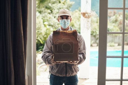 Photo for Portrait, parcel and face mask for delivery man at door with courier for shipment, e commerce and package. House, transport and service with box for postage, safety compliance and online shopping. - Royalty Free Image