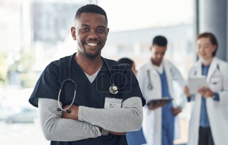 Black man, nurse and arms crossed in hospital or medical meeting with confidence, integrity or about us. Portrait of healthcare doctor in leadership with ADN support, advice or planning in USA clinic.