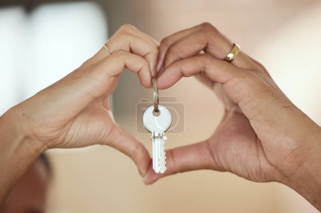 Photo for Couple, heart and hands with keys for new home, investment and marriage in love for growth, care and support. Mortgage, people and sign together in house, apartment or property for building future. - Royalty Free Image