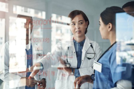Photo for Doctor, people and team work on glass board for medical solution, brainstorming or problem solving in internship. Healthcare student or nurse talking, training and giving advice for orthopedic steps. - Royalty Free Image