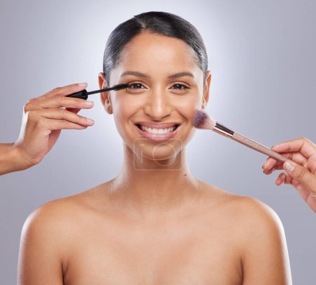 Woman, makeup brush and studio for beauty, hands and cosmetics on gray background. Cosmetology, portrait and mascara for facial treatment, tools and foundation for application or contour powder.