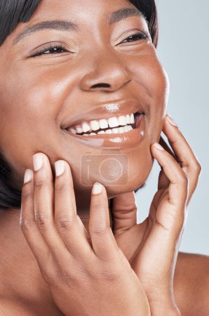 Photo for African woman, beauty and happy in studio with glow for thinking, results and cosmetics by background. Girl, person and model with lipstick, smile and excited with makeup product for transformation. - Royalty Free Image