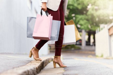 Photo for Legs, woman and walking in city for shopping on luxury vacation or trip in San Francisco, bags and journey to retail store. Girl, outdoor and summer holiday for in street for fashion discount or sale. - Royalty Free Image
