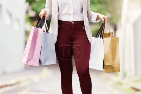 Photo for Legs, woman and outdoor in city for shopping on luxury vacation or trip in San Francisco, bags and journey to retail store. Girl, walking and summer holiday for in street for fashion discount or sale. - Royalty Free Image