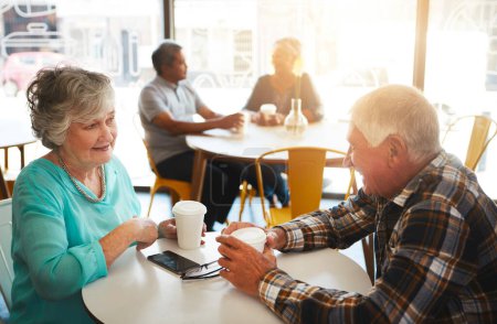 Photo for Senior couple, cafe and talking together, relationship bonding and discussion for retirement plan with married people. Break, restaurant meal and conversation and table, coffee and sitting or caring. - Royalty Free Image