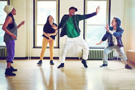 Foto de Hip hop, class and group dance energy, talent and performance and movement art practice for competition. Dancer, music and culture with diversity or friends together, fun and expression for joy. - Imagen libre de derechos