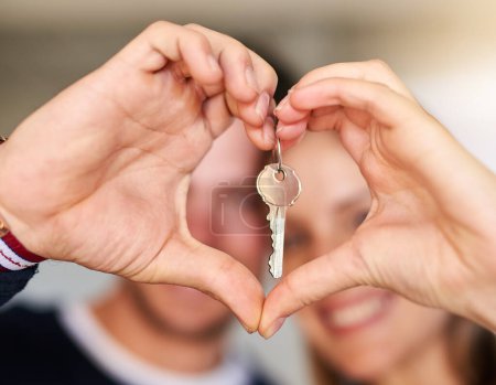 Photo for Portrait, couple and keys for new home, heart hands and real estate with love, support and trust. Closeup, man and woman with care emoji, lock for security and symbol for kindness, house and mortgage. - Royalty Free Image