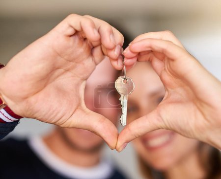 Photo for Happy couple, heart hands and new home with keys for love, apartment or investment together. Closeup of young man, woman or owners with emoji, vote or review for property, mortgage or access to house. - Royalty Free Image