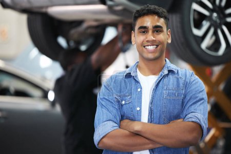 Photo for Portrait, man and smile as mechanic in automobile, workshop and repairs with confident or pride as engineer. Male person, worker and automotive in industry as maintenance, service and expert for cars. - Royalty Free Image