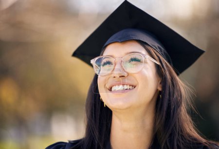 Photo for University, happy and girl in nature with graduation for achievement, growth and success in education. Student, smile and thinking with pride at academy for scholarship, academic goals and knowledge. - Royalty Free Image