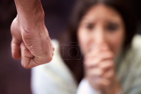 Photo for Fist, scared and woman with hands for domestic violence, sexual harassment or fight crime in studio. Pain, anxiety and girl in fear with man for gender abuse, danger and crying on black background - Royalty Free Image