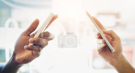 Photo for Hands, friends and smartphone with typing, connection and sunshine with internet, social media and communication. Closeup, lens flare and people with cellphone, mobile user and website info with app. - Royalty Free Image