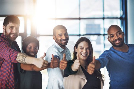 Business people, portrait and thumbs up for teamwork as real estate agency for loan approval, insurance or agreement. Men, women and diversity with group solidarity for yes praise, target or deal.