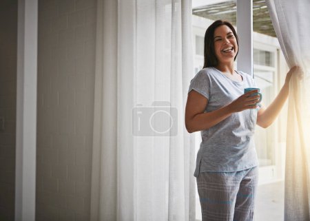 Foto de Woman, coffee and open curtain in morning, glass door and fresh wake up with sunrise in hotel ready for day. Routine, outside view and holiday or weekend, drapes and light in apartment in bedroom. - Imagen libre de derechos
