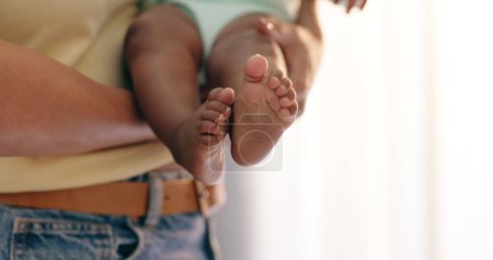 Photo for Hands, baby and feet closeup in home for parent support or development bonding, wellness or love. Fingers, toes and foot carrying for playful connection or youth care for happiness, trust or rest. - Royalty Free Image