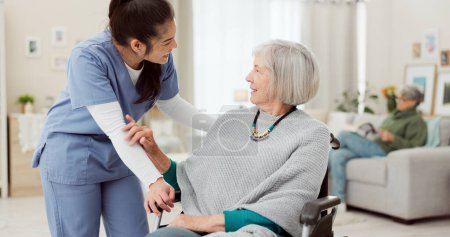 Photo for Nurse, wheelchair and happy woman for support, healthcare service and medical kindness and nursing. Doctor, caregiver and people talking or senior patient with disability, consulting or home helping. - Royalty Free Image
