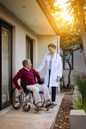 Photo for Patient with disability, senior care and wheelchair with nurse talking to old man on patio of old age home. Doctor, healthcare or medical with woman and elderly person at assisted living apartment. - Royalty Free Image