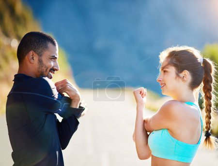 Foto de Man, woman and outdoor stretching for fitness warm up or arm mobility on mountain path, coach or running. Personal trainer, client and nature workout for training support or friends, cardio or sport. - Imagen libre de derechos