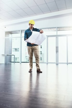 Photo for Architecture, man and reading blueprint for design, safety and floor plan with upgrade for development as project management. Male engineer, paper and construction worker for sketch of renovation. - Royalty Free Image